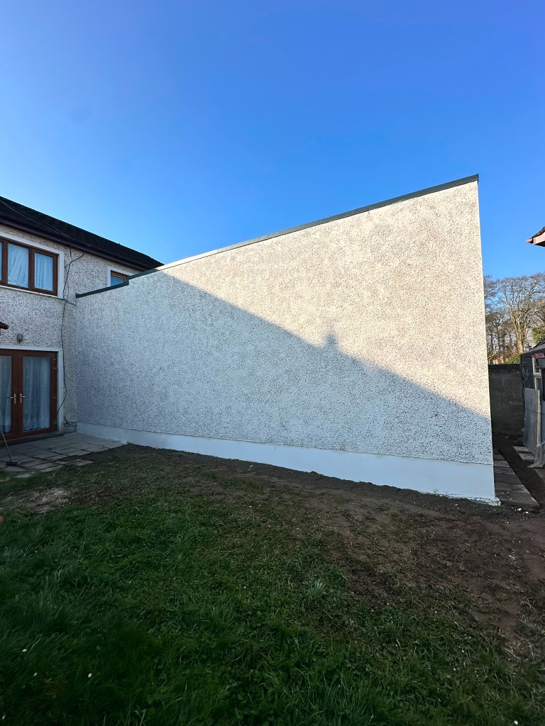 Finished textured pebbledash wall front view