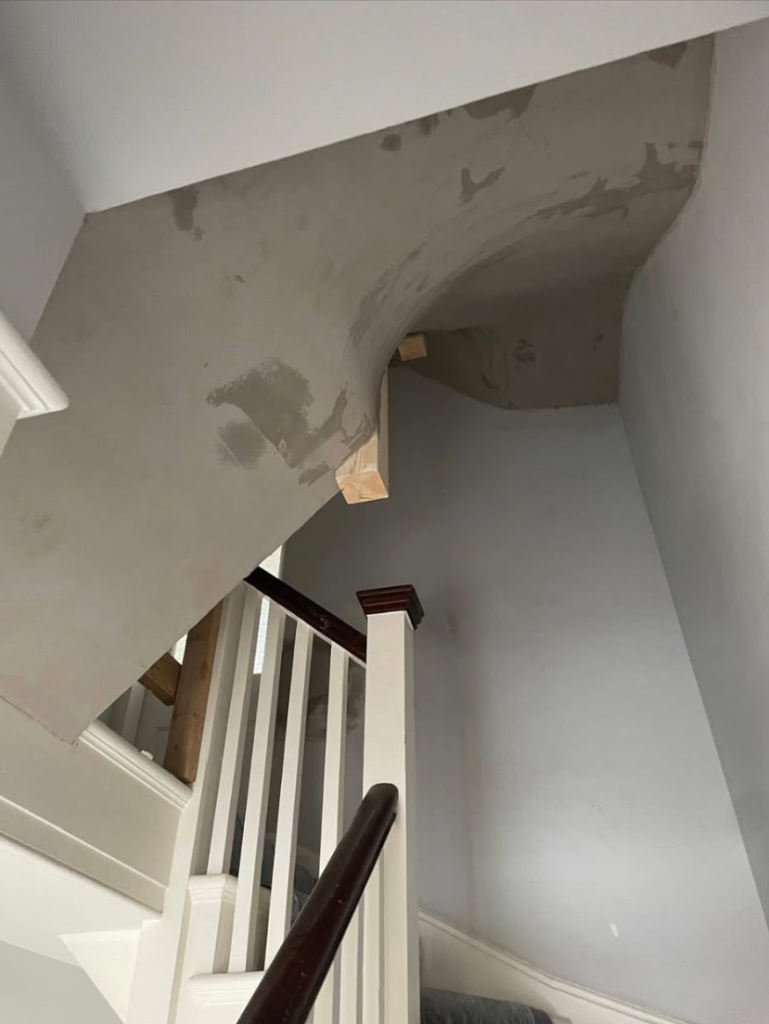 Finished smooth arched staircase plastering and skimming